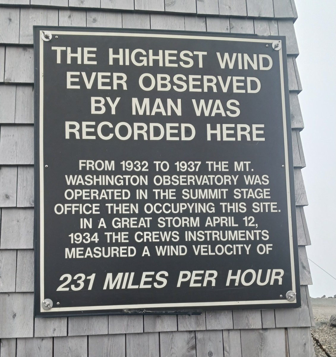 20240811_Jackson NH - Mt. Washington, NH - Sign on building chained down.jpg